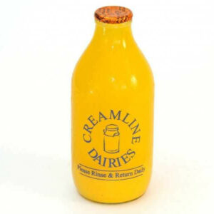 One pint of orange juice in a glass bottle